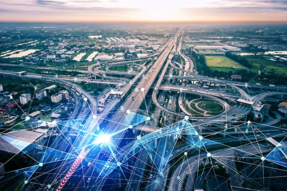 AI-generated aerial view of freeway interchange with digital lines overlaid to indicate AI traffic management